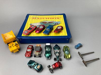 Die-Cast Toy Cars with Matchbox Storage Case. Collection of die-cast toy cars featuring 4 red 