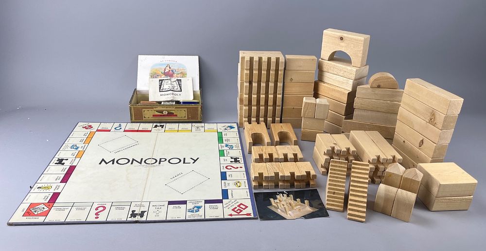 Monopoly Board Game with Wooden Blocks. Monopoly board game featuring wooden building blocks. 