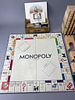 Monopoly Board Game with Wooden Blocks. Monopoly board game featuring wooden building blocks. Image - 1