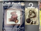 Assortment of Cross Stitch Kits and Quilted Bibs. Assortment of cross stitch kits and quilted Image - 4