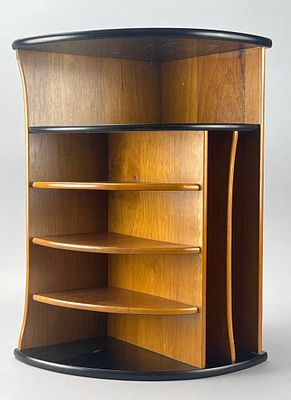 Pomerantz Wooden Corner Shelf. Pomerantz triangular wooden corner shelf featuring a black top 