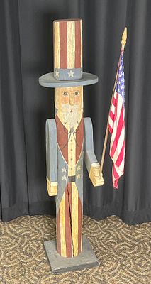Wooden Patriotic Figure with Flag and Tall Hat. Wooden figure with a painted patriotic design 