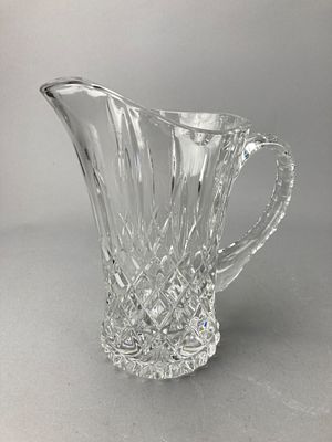 Clear Glass Pitcher with Diamond-Cut Pattern. Clear glass pitcher featuring a diamond-cut 