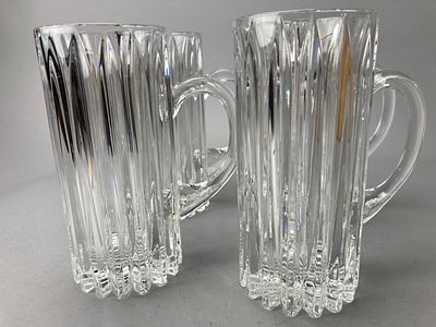 Set of Four Clear Glass Mugs with Handles. Set of four clear glass mugs featuring a vertical 