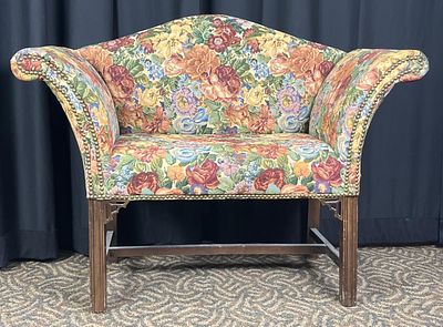 Floral Upholstered Settee with Wooden Frame. Floral upholstered settee with a wooden frame and 