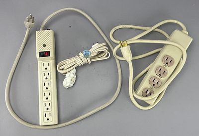 Plastic and Metal Power Strips with Multiple Outlets. Two power strips with multiple outlets 