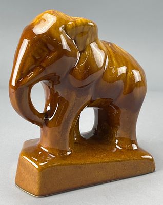 Art Pottery Elephant Figurine with Marbled Brown Glaze. Glossy ceramic elephant figurine with a 
