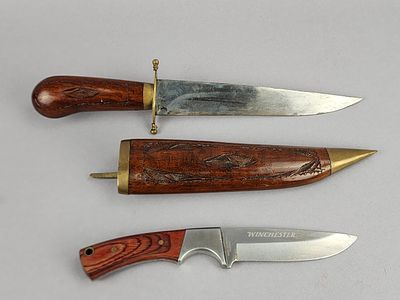 2 Fixed Blade Knives. Group of two fixed-blade hunting knives. The larger is an India-marked 
