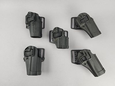 5 Blackhawk CQC Concealment Holsters. Five BLACKHAWK! CQC Concealment right-hand pistol holsters 