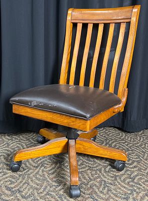 Mission-Style Oak Slat-Back Swivel Office Chair. Mission-style oak office chair with a tall 