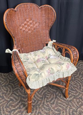 High-Back Rattan Wicker Fan-Back Armchair With Cushion. Traditional brown-finished rattan and 