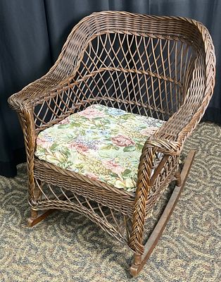 Early 20th Century Wicker Rocking Chair. Early 20th-century wicker rocking armchair with a high 