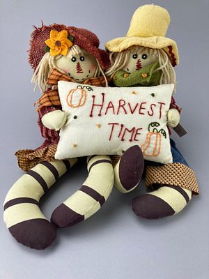 Fabric Scarecrow Dolls with "Harvest Time" Pillow. Two fabric scarecrow dolls dressed in 