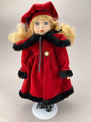Tuss Inc. Porcelain Doll in Red Coat With Stand. Tuss Inc. porcelain collector doll with blonde 