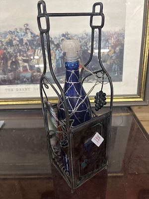 iron bottle holder complete with coloured glass bottle and lights