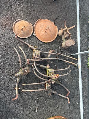 lot of old haybob tangs, cast pot lids and scales