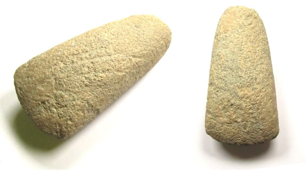 Lot 1002: Neolithic polished stone axehead. Circa 3500 BC-2100 BC. 370.0g. 145.69...