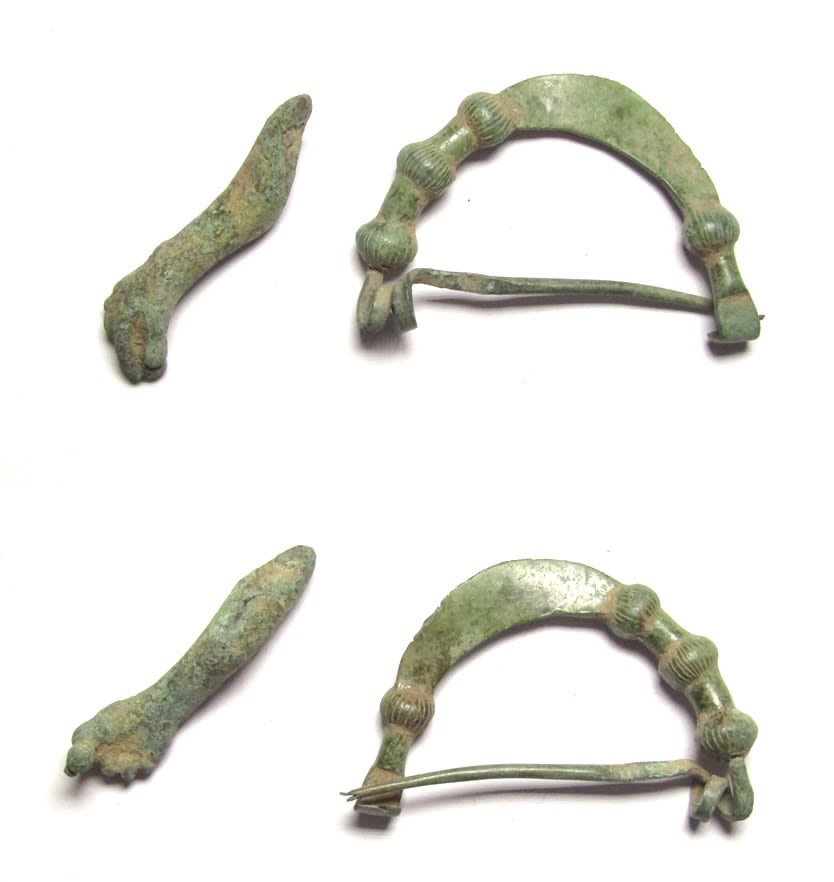 Lot 1010: Ancient Artefact Lot (2). Phrygian bronze arched brooch....