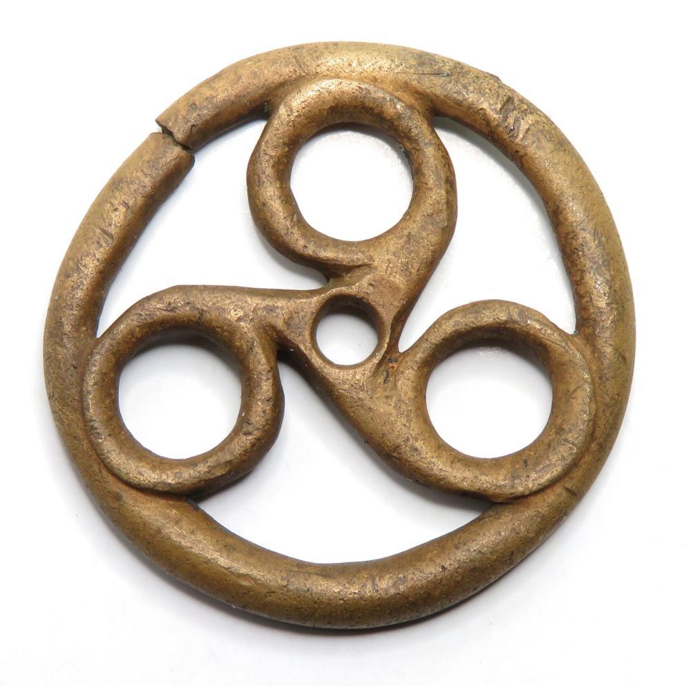 Lot 1012: Iron age bronze triskele harness mount or fob...