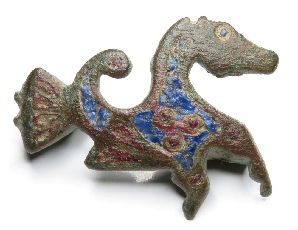 Lot 1015: Roman enamelled hippocampus brooch. Copper-alloy, 5.58g. 29.15 mm....