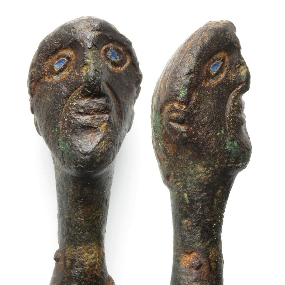 Lot 1032: Roman anthropomorphic bronze knife handle. The handle has...