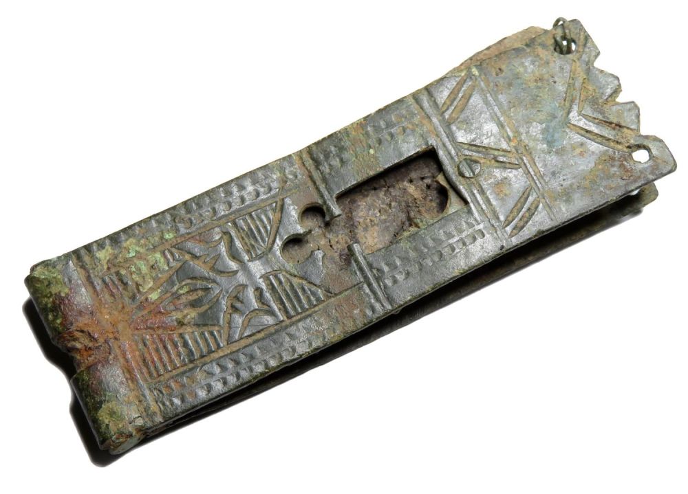 Lot 1061: Medieval buckle plate. Circa 14th century AD. Copper-alloy,...