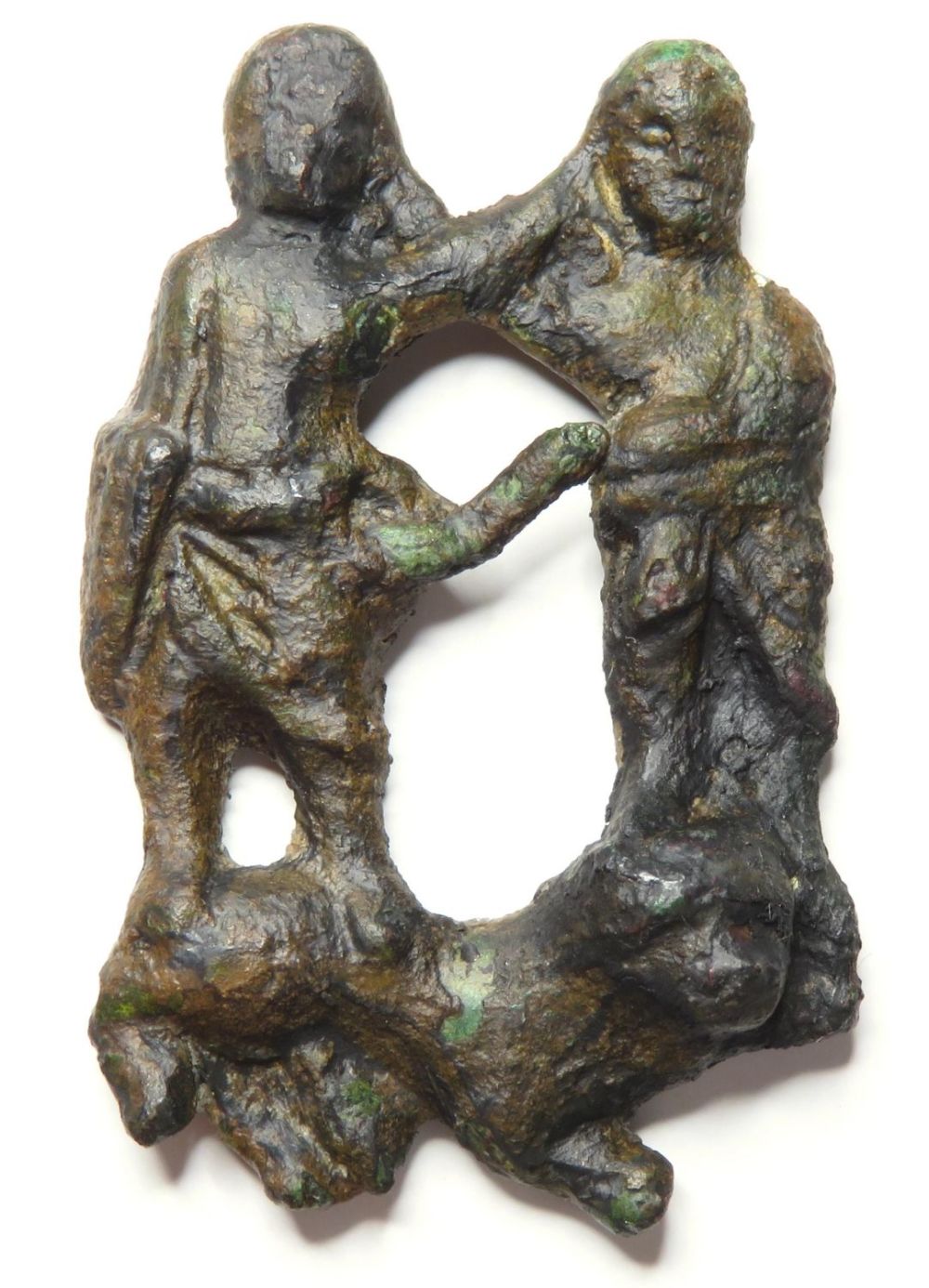 Lot 1063: Medieval Figural Brooch. Circa 12th-13th Century AD. Copper-alloy,...