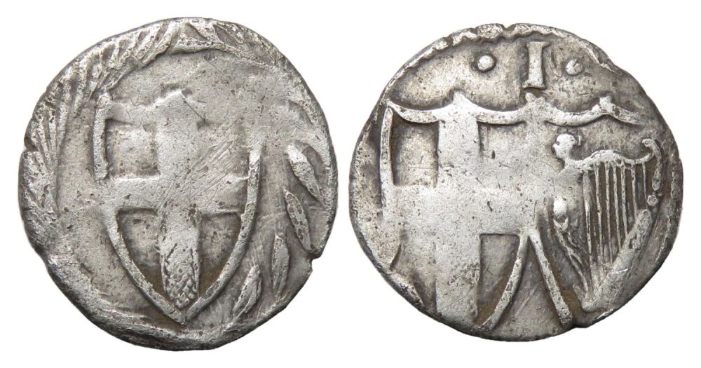 Lot 1254: Commonwealth Penny. Silver, 0.45g. 12.10 mm. Shield enclosing...