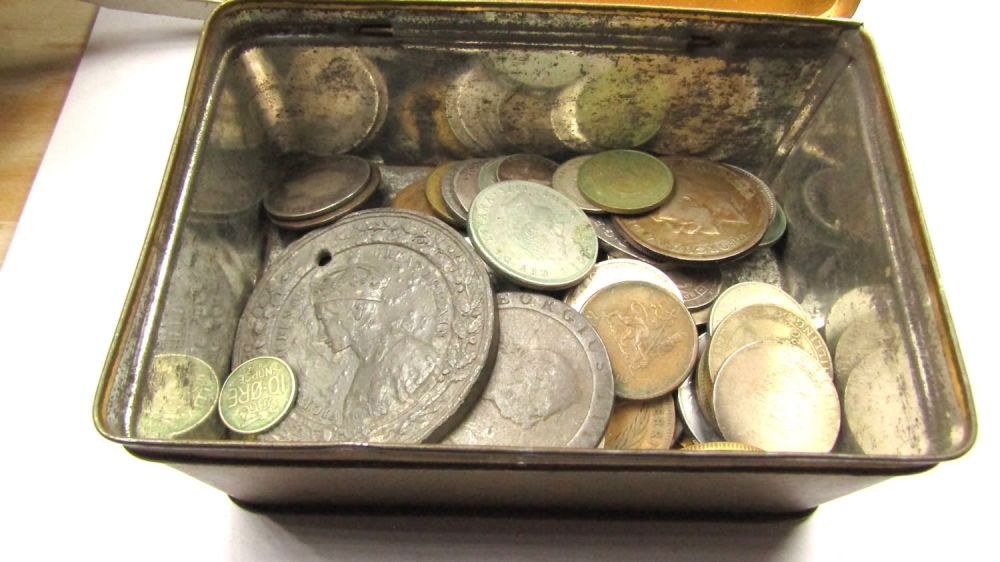 Lot 1275: Old tin containing commemorative medals, silver coins from...