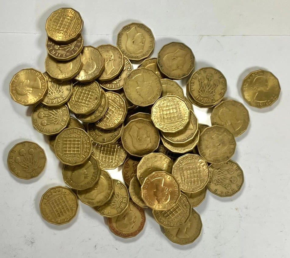 Lot 1293: British Milled, 348g of brass threepence pieces from...
