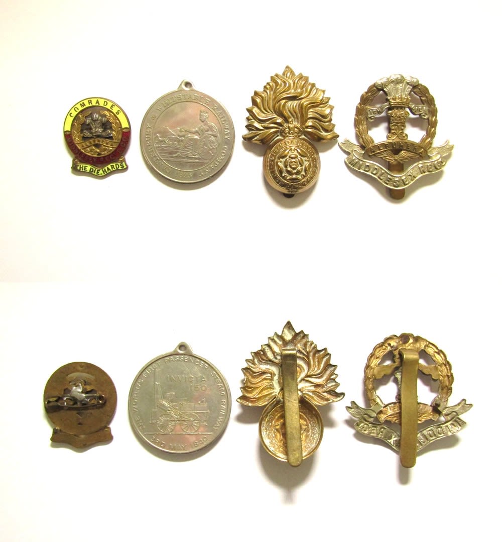 Lot 1351: Collection of military badges and railway medal. An...