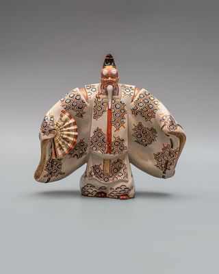 Окимоно "Окина". Япония, Киото, эпоха Мэйдзи (1868-1912). 
Керамическая масса, глазурь 