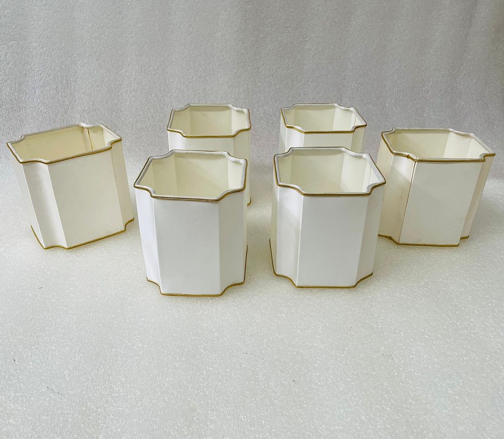Set of Silk Shades
. Set comprising 6 lampshades in natural silk with gold detail for thin socket.