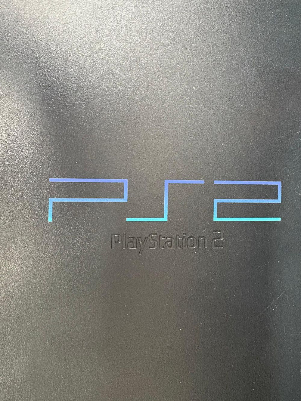 Playstation 2 console with cables. Signs of use.