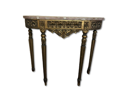 Console table with gold-painted wooden legs and carved woodwork. Marble top. Signs of use.