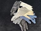 Pair of Gloves Set. Set consisting of 7 unmatched gloves in various colors. Signs of use.Image - 2
