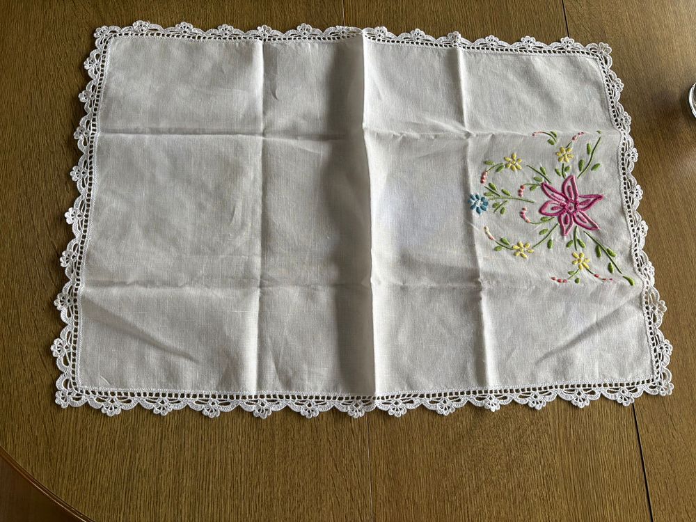 Embroidered Linen Napron. Embroidered linen napkin with lace border. Signs of wear.