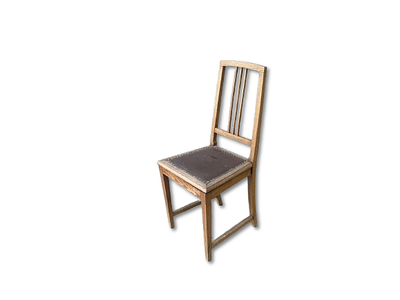 Chair. Wooden chair with fabric seat. Signs of wear and tear.