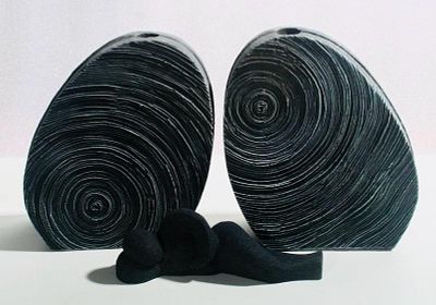 Set of Vases and Statue. Set consisting of two jars and a statuette in volcanic stone.