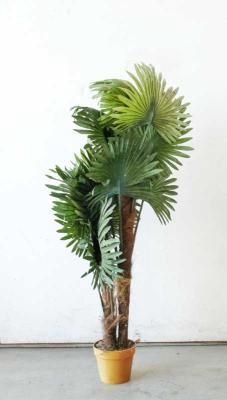 Palm Tree Artificial. Artificial palm tree with pot. Signs of use.