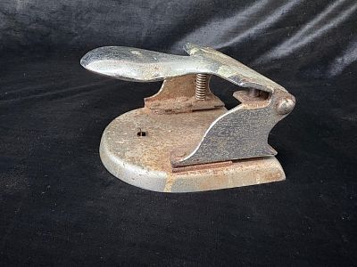 Vintage Stapler. Vintage stapler made of very old and heavy metal. Signs of wear and rust.