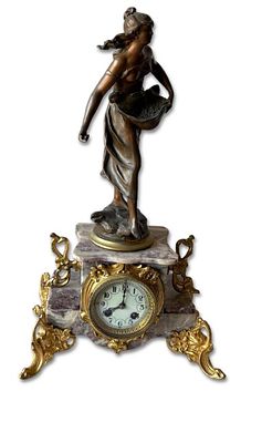 French Table Clock. French Napoleon III table clock, in marble with reliefs and bronze. The 