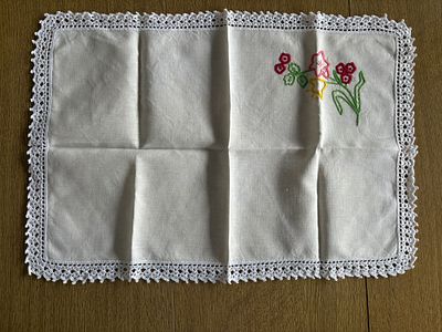 Linen Napkin. Linen napkin with embroidery and lace border. Signs of wear.