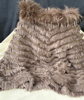 Rabbit poncho made of knit fabric. One size fits all. In excellent condition.