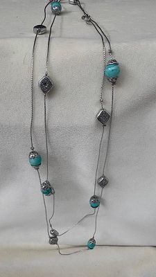 Collar. Grey necklace with blue stones. Signs of wear.