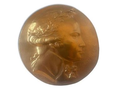 Bronze Medallion. Bronze medallion signed by French artist. Signs of use. 
Ring on the back for 