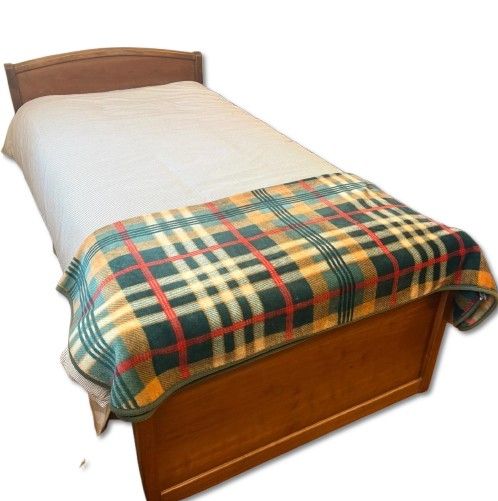 Bed. Single bed made of walnut wood. Includes bed frame and mattress. Signs of use.