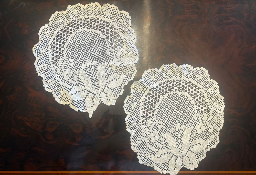 Lace Cloths. Handmade lace cloths in a circular shape. Signs of use.