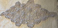 Lace Cloth. Handmade lace cloth in an oval shape. Signs of use.Image - 2