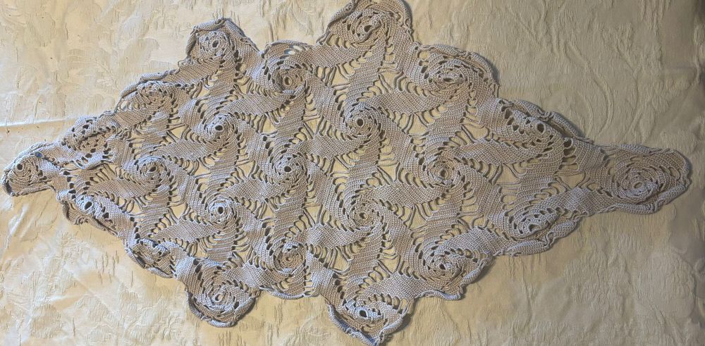 Lace Coth. Handmade lace cloth in an oval shape. Signs of use.